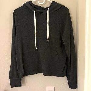 Dark grey cropped hoodie with white draw strings